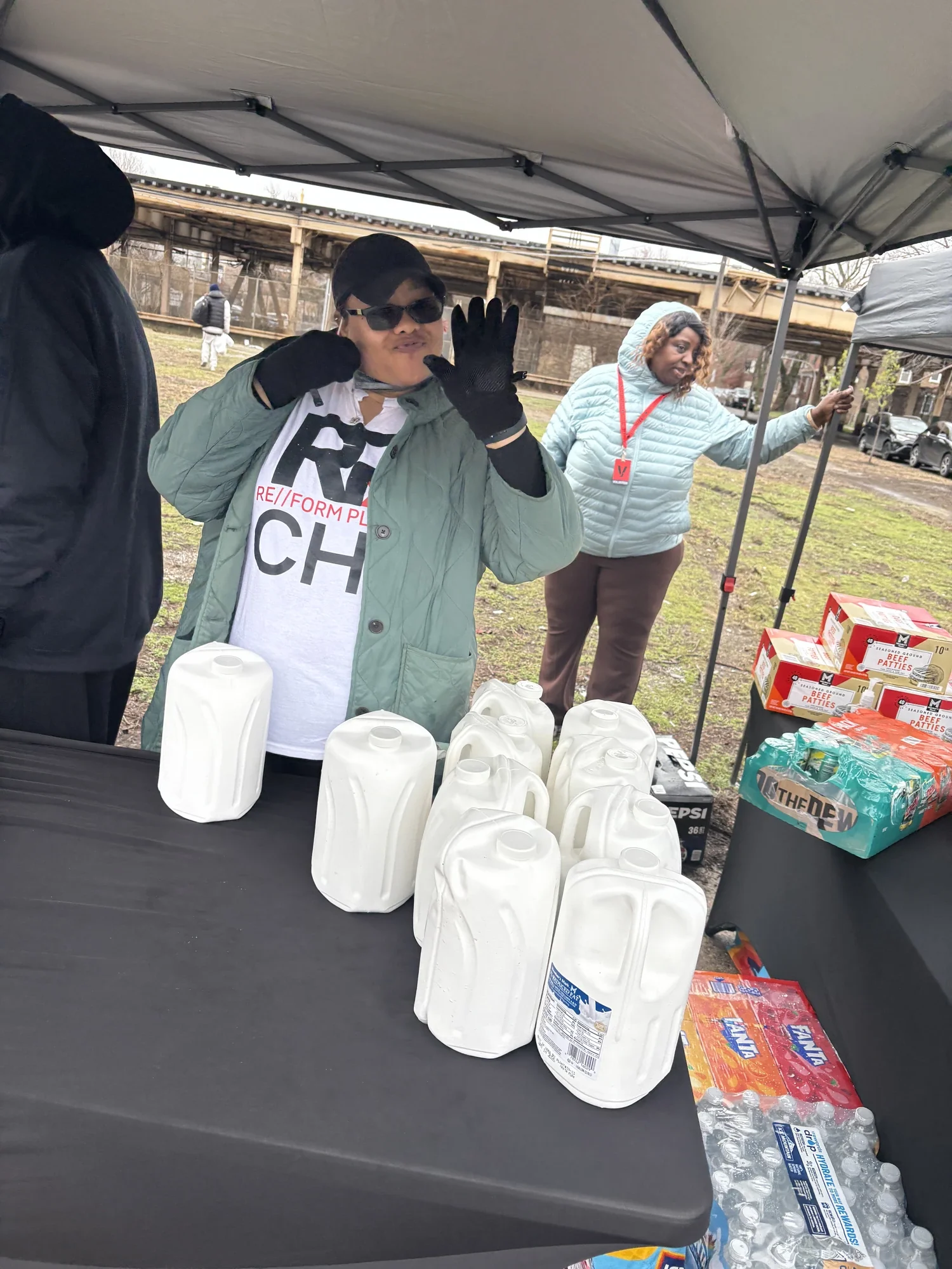 RE//FORM PLACE CHI branded outreach — water and food distribution