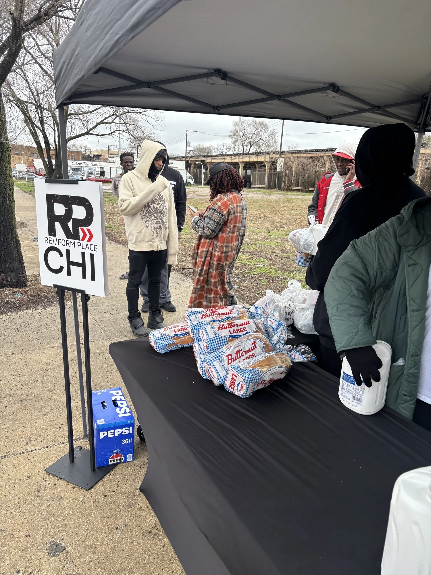 Handing out food bags to the community