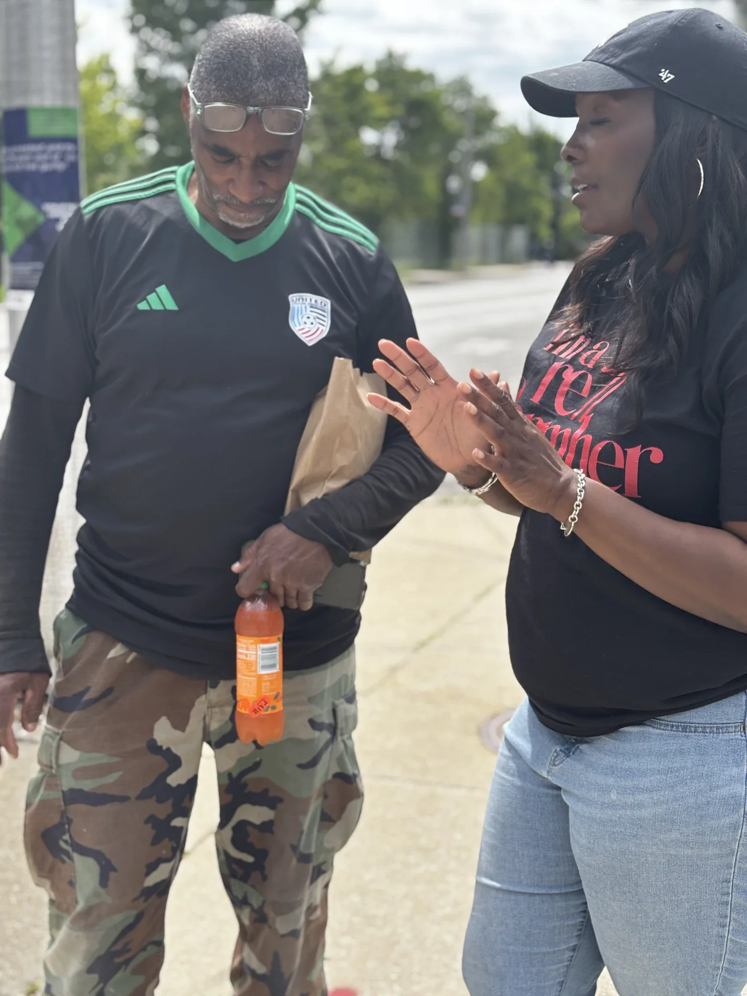 Praying on the street with a neighbor